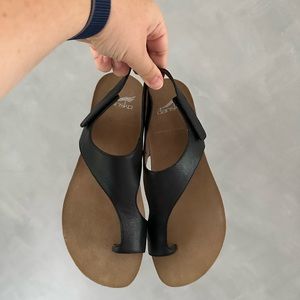 Dansko Reece Sandals in Black Waxy Burnished Colorway